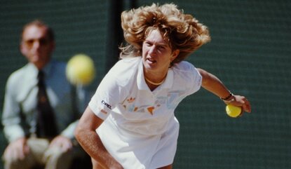 Steffi Graf of Germany serves against Martina Navratilova during their Women's Singles Final at the Wimbledon Lawn Tennis Championship on 4 July 1987 at the All England Lawn Tennis and Croquet Club in Wimbledon in London, England. (Photo by Chris Col...