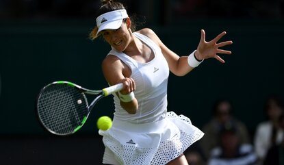 LONDON, ENGLAND - JUNE 27: Gabrine Muguruza of Spain plays a forehand shot during the Ladies Singles first round match against Camila Giorgi of Italy on day one of the Wimbledon Lawn Tennis Championships at the All England Lawn Tennis and Croquet Cl...