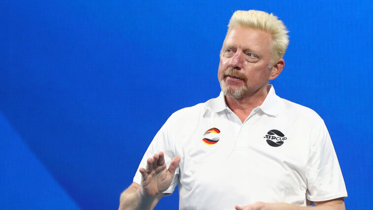 Boris Becker gives instructions on the court