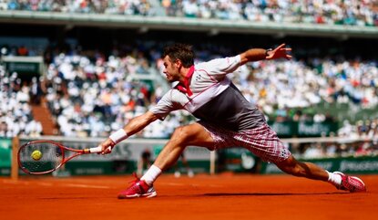 PARIS, FRANCE - JUNE 07: Stanislas Wawrinka of Switzerland returns a shot in the Men's Singles Final against Novak Djokovic of Serbia on day fifteen of the 2015 French Open at Roland Garros on June 7, 2015 in Paris, France. (Photo by Julian Finney/...
