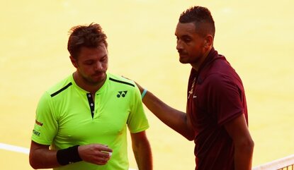 MADRID, SPAIN - MAY 04: Nick Kyrgios of Australia shakes hands at the net after his straight sets victory against Stanislas Wawrinka of Switzerland in their second round match during day five of the Mutua Madrid Open tennis tournament at the Caja Ma...
