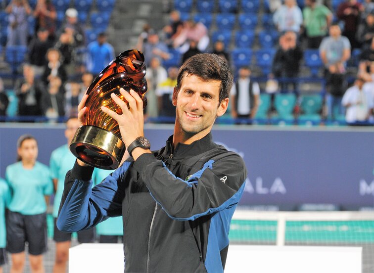 Novak Djokovic with the trophy in Abu Dhabi