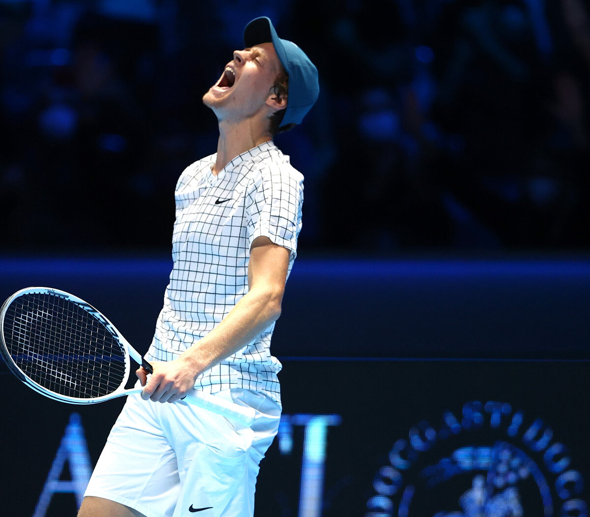 Jannik Sinner of Italy plays a forehand in his quarter final match