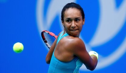 WUHAN, CHINA - SEPTEMBER 28: Heather Watson of Great Britain returns a shot to Jelena Jankovic of Serbia during her match on day 2 of 2015 Dongfeng Motor Wuhan Open 2015 at Optics Valley International Tennis Center on September 28, 2015 in Wuhan, Ch...