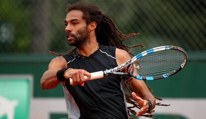 PARIS, FRANCE - MAY 22: Dustin Brown of Germany hits a forehand during the Men's Singles first round match against Dudi Sela of Israel on day one of the 2016 French Open at Roland Garros on May 22, 2016 in Paris, France. (Photo by Clive Brunskill/G...
