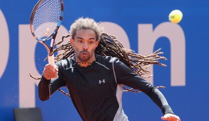 MUNICH, GERMANY - APRIL 27: Germany's Dustin Brown hits the ball during his second round match against Argentina's Juan Martin del Potro during the BMW Open tennis tournament at Iphitos tennis club on April 27, 2016 in Munich, Germany. (Photo by Al...