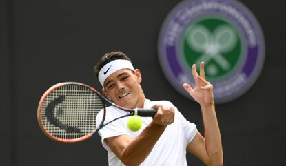 LONDON, ENGLAND - JUNE 28: Taylor Fritz of The United States plays a backhand during the Men's Singles first round match against Stan Wawrinka of Switzerland on day two of the Wimbledon Lawn Tennis Championships at the All England Lawn Tennis and Cr...