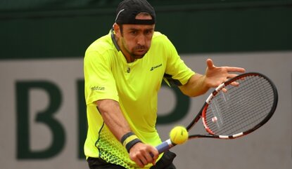 PARIS, FRANCE - MAY 22: Benjamin Becker of Germany hits a backhand during the Men's Singles first round match against Andrey Kuznetsov of Russia on day one of the 2016 French Open at Roland Garros on May 22, 2016 in Paris, France. (Photo by Dennis ...