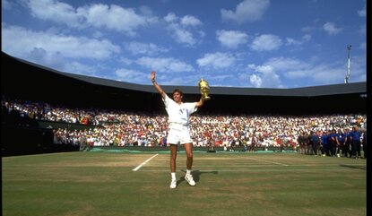 7 JUL 1991: MICHAEL STICH OF GERMANY HOLDS THE MEN's SINGLES TROPHY UP TO THE CROWD AT THE 1991 WIMBLEDON CHAMPIONSHIPS.