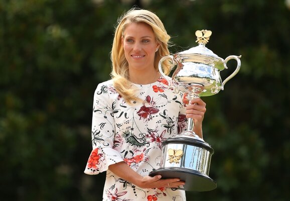Angelique Kerber of Germany holds the Daphne Akhurst Memorial Cup during a photocall at Government House after winning the 2016 Australian Open on January 31, 2016 in Melbourne, Australia.