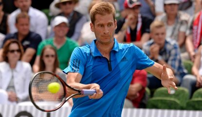 STUTTGART, GERMANY - JUNE 10: Florian Mayer of Germany returns against Roger Federer of Switzerland during the quarterfinals on day 7 of Mercedes Cup 2016 on June 10, 2016 in Stuttgart, Germany. (Photo by Daniel Kopatsch/Bongarts/Getty Images)