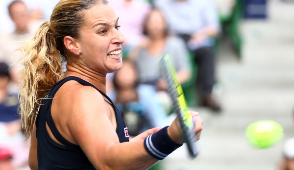 TOKYO, JAPAN - SEPTEMBER 26: Dominika Cibulkova of Slovakia plays a forehand in her match against Agnieszka Radwanska of Polandduring day one of the Toray Pan Pacific Open at Ariake Colosseum on September 26, 2015 in Tokyo, Japan. (Photo by Koji Wata...
