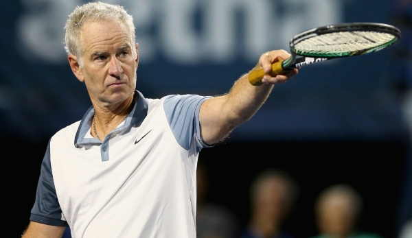 NEW HAVEN, CT - AUGUST 28: John McEnroe reacts during his match against Jim Courier as part of the Men's Legends presented by PowerShares Series at the Connecticut Open at Connecticut Tennis Center at Yale on August 28, 2015 in New Haven, Connecticu...