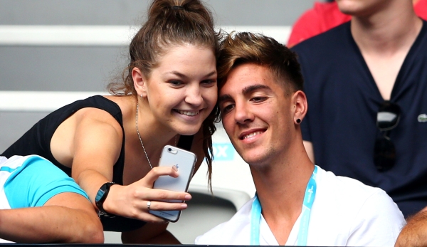 MELBOURNE, AUSTRALIA - JANUARY 19: Thanasi Kokkinakis of Australia poses for a selfie with a fan during the first round match between Bernard Tomic of Australia and Denis Istomin of Uzbekistan during day two of the 2016 Australian Open at Melbourne ...