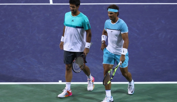 INDIAN WELLS, CA - MARCH 12: Rafael Nadal and Fernando Verdasco of Spain look on in their doubles match against Bob and Mike Bryan of USA during day six of the BNP Paribas Open at Indian Wells Tennis Garden on March 12, 2016 in Indian Wells, Califor...