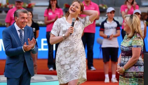 MADRID, SPAIN - MAY 11: Dinara Safina of Russia makes a speach to the crowd announcing her retirement watched by Stacey Allaster, CEO of the WTA Tour and Manolo Santana, tournament director before the prize giving ceremony for Maria Sharapova of Rus...