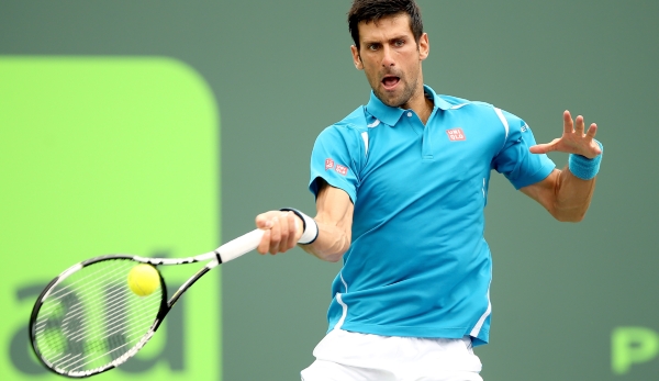 KEY BISCAYNE, FL - APRIL 03: Novak Djokovic of Serbia returns a shot to Kei Nishikori of Japan during the final on Day 14 of the Miami Open presented by Itau at Crandon Park Tennis Center on April 3, 2016 in Key Biscayne, Florida. (Photo by Matthew...