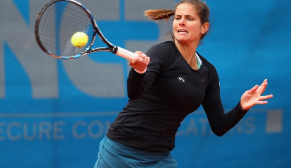 NUREMBERG, GERMANY - MAY 17: Julia Goerges of Germany returns the ball to Cristina Dinu of Romania during day four of the Nuernberger Versicherungscup 2016 on May 17, 2016 in Nuremberg, Germany. (Photo by Alex Grimm/Bongarts/Getty Images)