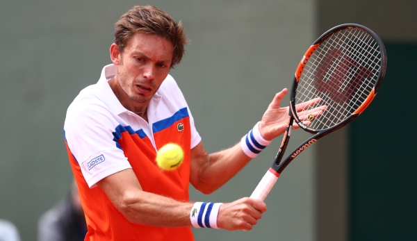 PARIS, FRANCE - MAY 24: Nicolas Mahut of France plays a backhand during the Men's Singles first round match against Ricardas Berankis of Lithuania on day three of the 2016 French Open at Roland Garros on May 24, 2016 in Paris, France. (Photo by Jul...