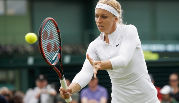 LONDON, ENGLAND - JUNE 27: Sabine Lisicki of Germany plays a back hand shot during the Ladies Singles first round match against Shelby Rogers of The United States on day one of the Wimbledon Lawn Tennis Championships at the All England Lawn Tennis a...