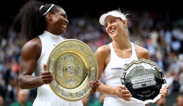 LONDON, ENGLAND - JULY 09: Serena Williams of The United States and Angelique Kerber of Germany in conversation as they hold their trophies following The Ladies Singles Final on day twelve of the Wimbledon Lawn Tennis Championships at the All Englan...