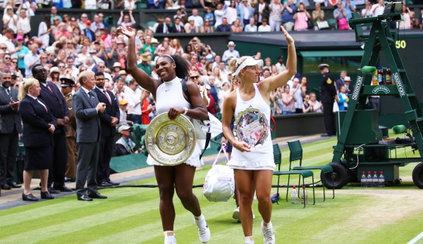 LONDON, ENGLAND - JULY 09: Serena Williams of The United States and Angelique Kerber of Germany wave to the crowd as they leave the court holding their trophies following The Ladies Singles Final on day twelve of the Wimbledon Lawn Tennis Championsh...