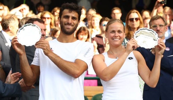 LONDON, ENGLAND - JULY 10: Robert Farah of Columbia and Anna-Lena Groenefeld of Germany lift their trophies following defeat in the Mixed Doubles Final against Heather Watson of Great Britain and Henri Kontinen of Finland on day thirteen of the Wimb...
