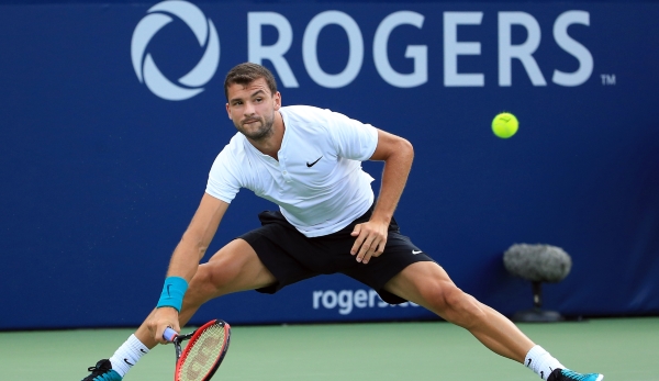 TORONTO, ON - JULY 25: Grigor Dimitrov of Bulgaria plays a shot against Yuichi Sugita of Japan during Day 1 of the Rogers Cup at the Aviva Centre on July 25, 2016 in Toronto, Ontario, Canada. (Photo by Vaughn Ridley/Getty Images)