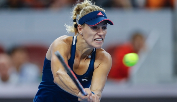 BEIJING, CHINA - OCTOBER 06: Angelique Kerber of Germany returns a shot against Elina Svitolina of Ukraine during the Women's singles third round match on day six of the 2016 China Open at the China National Tennis Centre on October 6, 2016 in Beij...