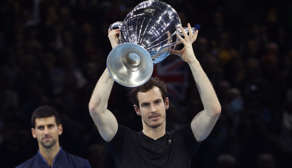 LONDON, ENGLAND - NOVEMBER 20: Andy Murray of Great Britain celebrates with the ATP Tour Trophy following his victory during the Singles Final against Novak Djokovic of Serbia at the O2 Arena on November 20, 2016 in London, England. (Photo by Julia...