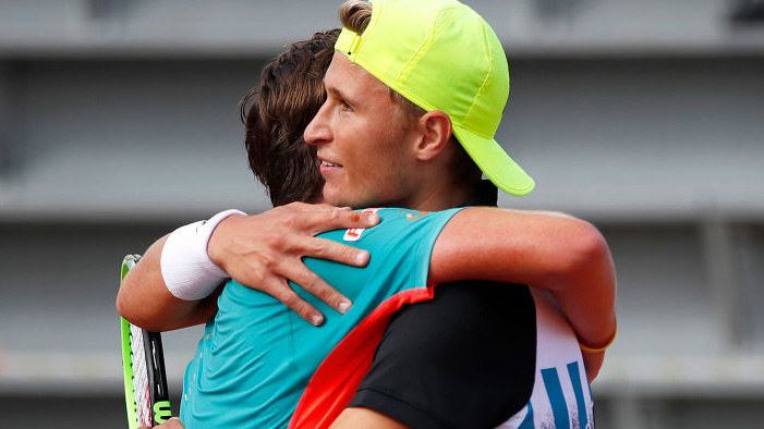 Leandro Riedi hugs Dominic Stricker after the 2020 French Open junior final